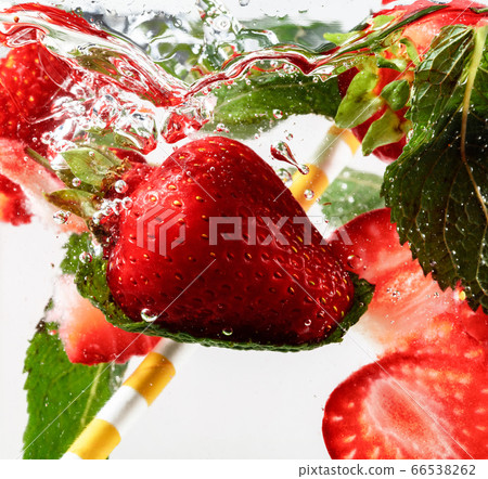 Close up view of the cold and fresh lemonade with bright berries in neon light 66538262