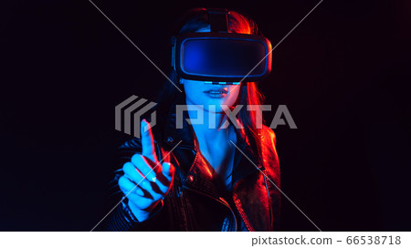 girl gets the experience of using virtual reality glasses girl gets the experience of using virtual reality glasses 66538718