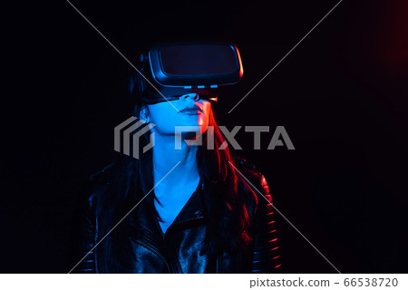 girl in modern virtual reality glasses on a black background girl in modern virtual reality glasses on a black background 66538720
