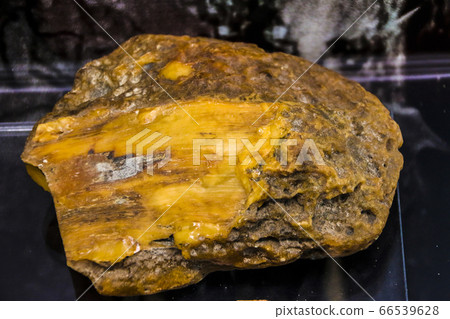 Fragments of amber close-up. Natural unpolished Fragments of amber close-up. Natural unpolished 66539628