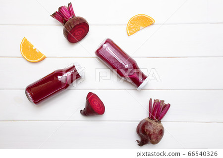 Healthy beetroot juice in a jars on white table Healthy beetroot juice in a jars on white table 66540326