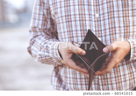 Man hand open an empty wallet isolated Man hand open an empty wallet isolated 66541015