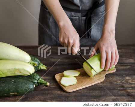 Zucchini harvesting concept. Zucchini harvesting concept. 66542557