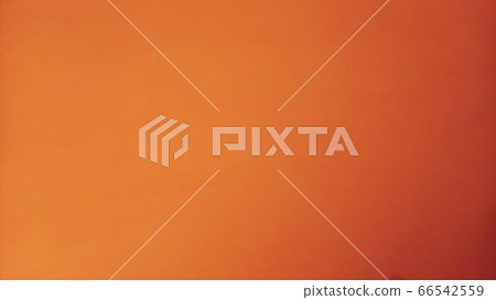 The paper is orange with a transition from yellow to dark orange. Light tone on the left, dark on the right. Texture, background, postcard. Warm fiery tone 66542559