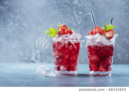 Red cocktail with ice and mint 66542854
