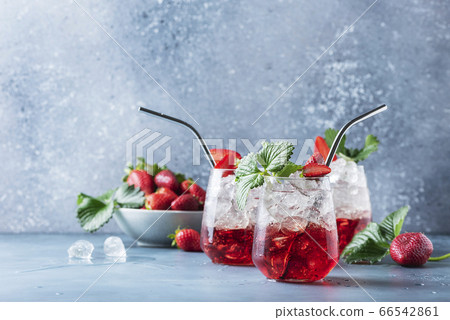 Red cocktail with ice and fresh strawberry Red cocktail with ice and fresh strawberry 66542861