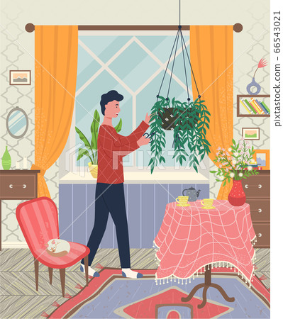 Man at Home, Living Room with Plants and Kitten Man at Home, Living Room with Plants and Kitten 66543021