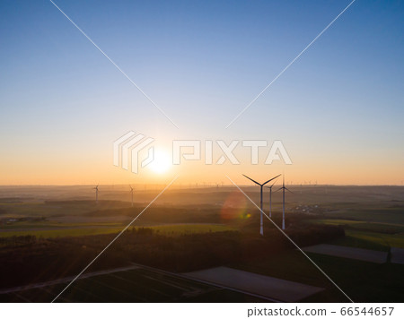 Aerial view of windturbines energy generator on amazing sunset at a wind farm in germany 66544657