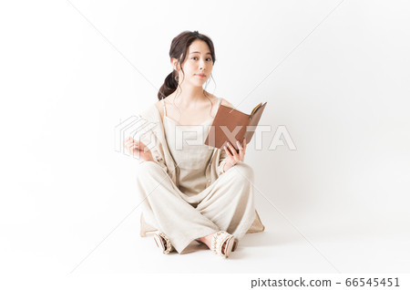 Woman in relax wear with a notebook Woman in relax wear with a notebook 66545451