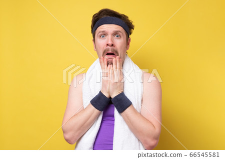 Man with mustache and towel shocked with surprise Man with mustache and towel shocked with surprise 66545581