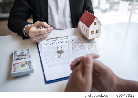 Real estate agent are presenting home loan and Real estate agent are presenting home loan and 66545822