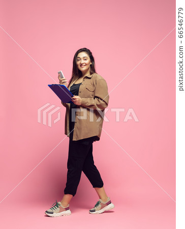 Young caucasian woman in casual wear. Bodypositive female character. plus size businesswoman 66546779