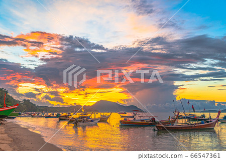 beautiful sunrise above fishing boats beautiful sunrise above fishing boats 66547361