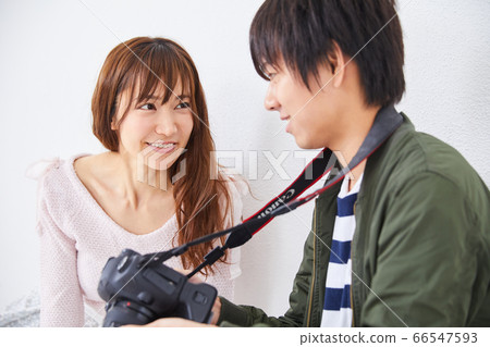 Young photographer and model woman Young photographer and model woman 66547593