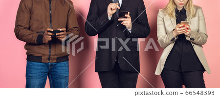 Group of friends using mobile smartphones. Teenagers addiction to new technology trends. Close up. 66548393