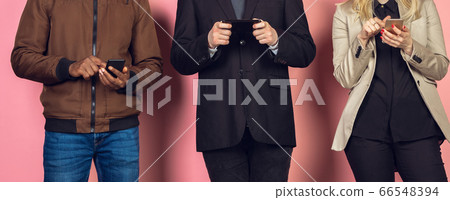 Group of friends using mobile smartphones. Teenagers addiction to new technology trends. Close up. 66548394