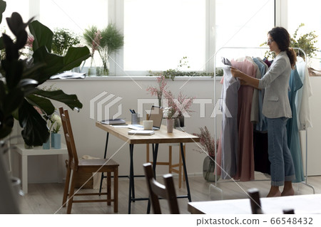 Stylish studio workplace of female fashion designer Stylish studio workplace of female fashion designer 66548432