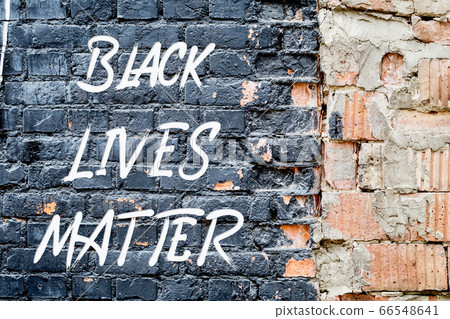 BLACK LIVES MATTER poster on black brick wall BLACK LIVES MATTER poster on black brick wall 66548641
