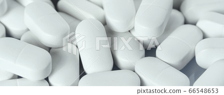 Background of white tablets or pills on the table. Medicine and pharmacy 66548653