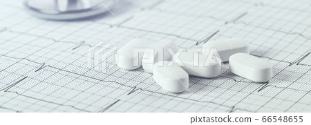 Background of white tablets or pills on the table. Medicine and pharmacy Background of white tablets or pills on the table. Medicine and pharmacy 66548655