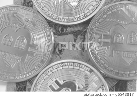 Silver bitcoin with U.S. dollar closeup Silver bitcoin with U.S. dollar closeup 66548817
