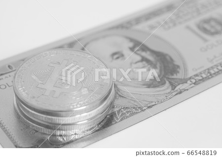 Silver bitcoins with U.S. dollar isolated on white Silver bitcoins with U.S. dollar isolated on white 66548819