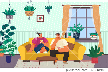 Couple Spending Weekend at Home Eating Popcorn 66548988