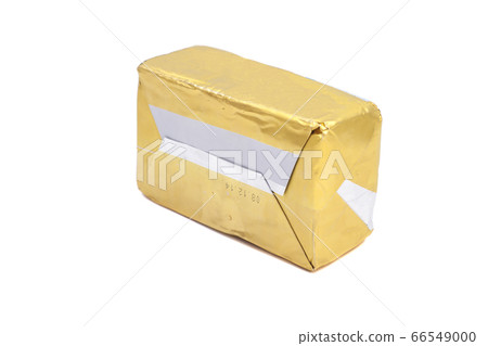 Stick of wrapped butter isolated on white Stick of wrapped butter isolated on white 66549000