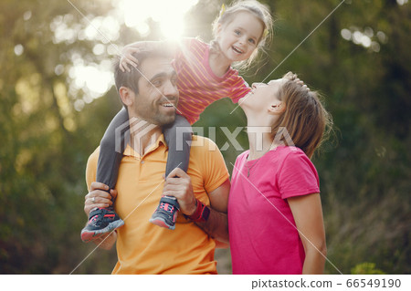 Cute family playing in a summer park Cute family playing in a summer park 66549190