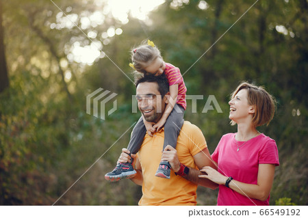 Cute family playing in a summer park Cute family playing in a summer park 66549192