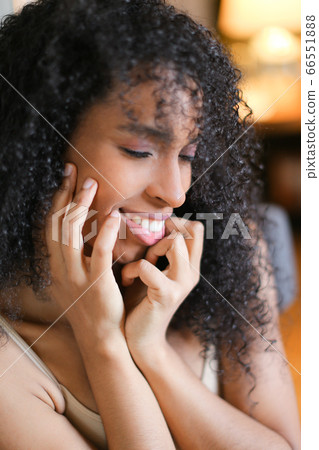 Portrait of young afro american curly haired smiling girl. Portrait of young afro american curly haired smiling girl. 66551888