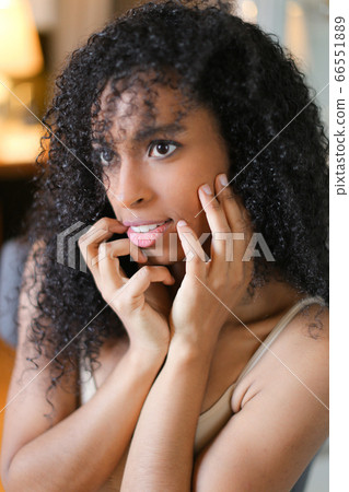 Portrait of young afro american curly haired girl. Portrait of young afro american curly haired girl. 66551889