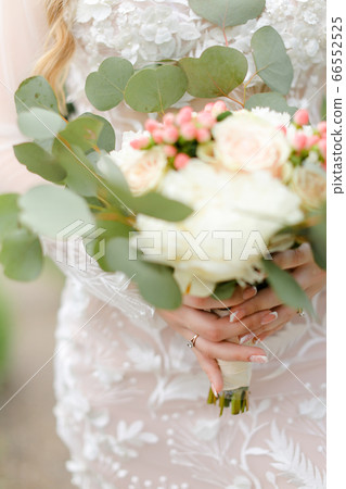 Closeup cute bride bouquet of roses. Closeup cute bride bouquet of roses. 66552525