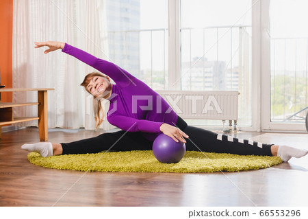 Flexible elderly lady exercise with sport ball Flexible elderly lady exercise with sport ball 66553296