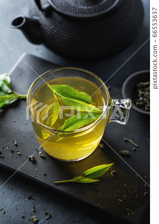 Brewed chinese green tea served in cup on table 66553637
