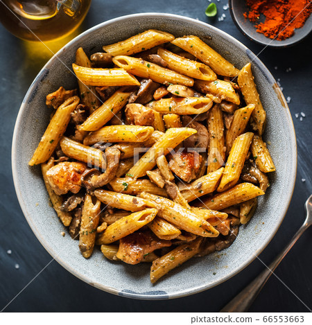Pasta penne with mushrooms and sauce 66553663