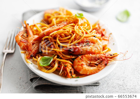 Pasta spaghetti with tomato sauce and shrimps 66553674