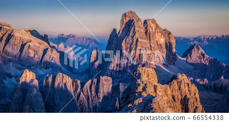 Dolomites mountain peaks glowing at sunset, South Tyrol, Italy Dolomites mountain peaks glowing at sunset, South Tyrol, Italy 66554338
