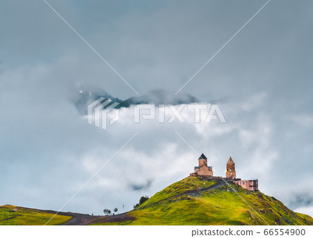 Ancient Gergeti Trinity church near mount Kazbek, Georgia Ancient Gergeti Trinity church near mount Kazbek, Georgia 66554900