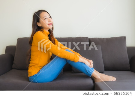 woman using laptop computer with smart mobile phone and credit card for online shopping 66555164