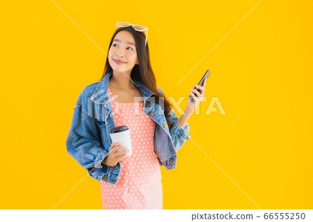 woman using laptop computer with smart mobile phone and credit card for online shopping 66555250