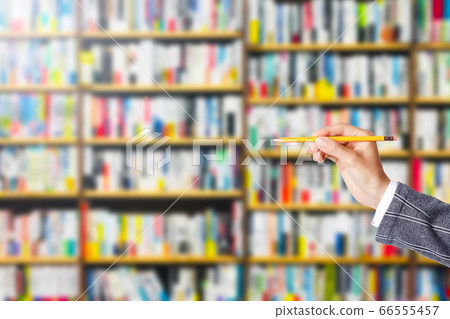 Person with pencil and bookshelf 66555457