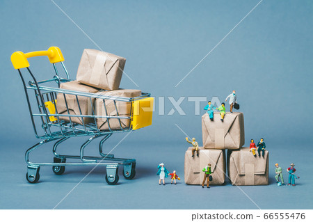 Miniature person shopping 66555476