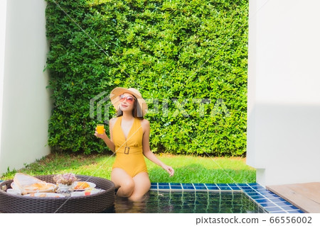 woman using laptop or computer noterbook on sofa with concept work from home woman using laptop or computer noterbook on sofa with concept work from home 66556002