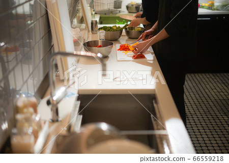 Cooking scene using paprika 66559218