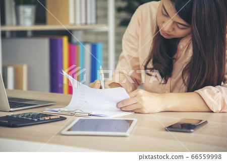 Work from home conceptual woman working on laptop Work from home conceptual woman working on laptop 66559998