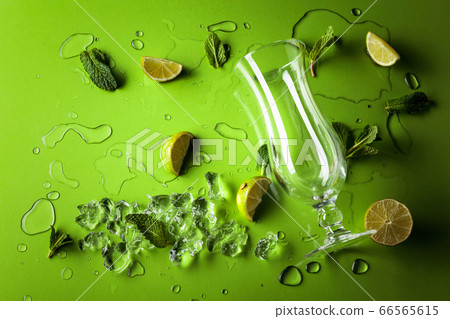 Mojito ingredients on a green background. Lime 66565615
