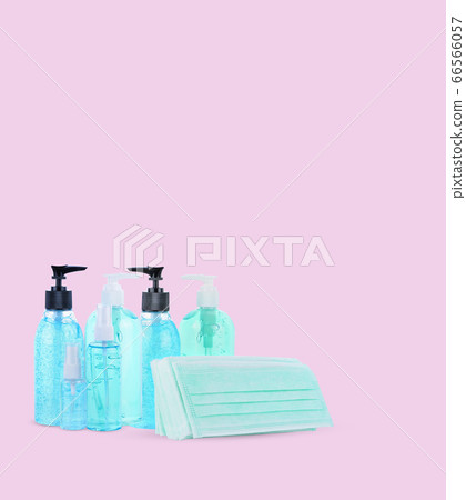 mask and alcohol gel on pink background mask and alcohol gel on pink background 66566057