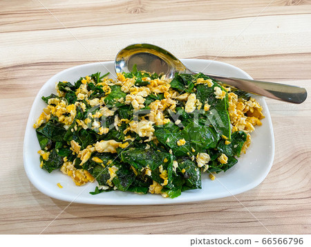 Stir-fried Malindjo leaves with egg on the table, this menu is favorite in the south of Thailand 66566796
