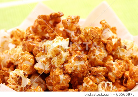 Caramel-flavored popcorn sweet and delicious Caramel-flavored popcorn sweet and delicious 66566973